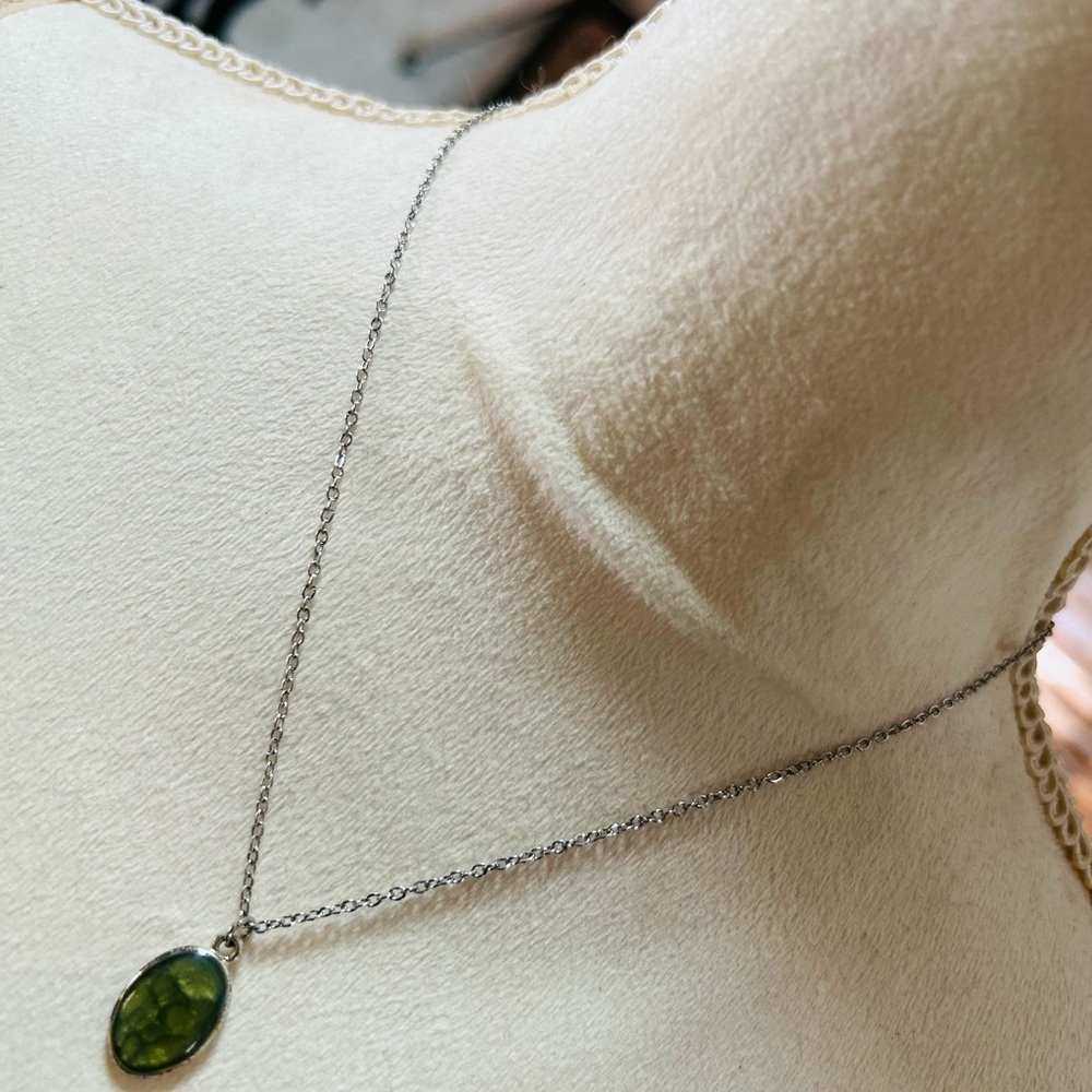Textured snake skin under resin pendant on chain necklace